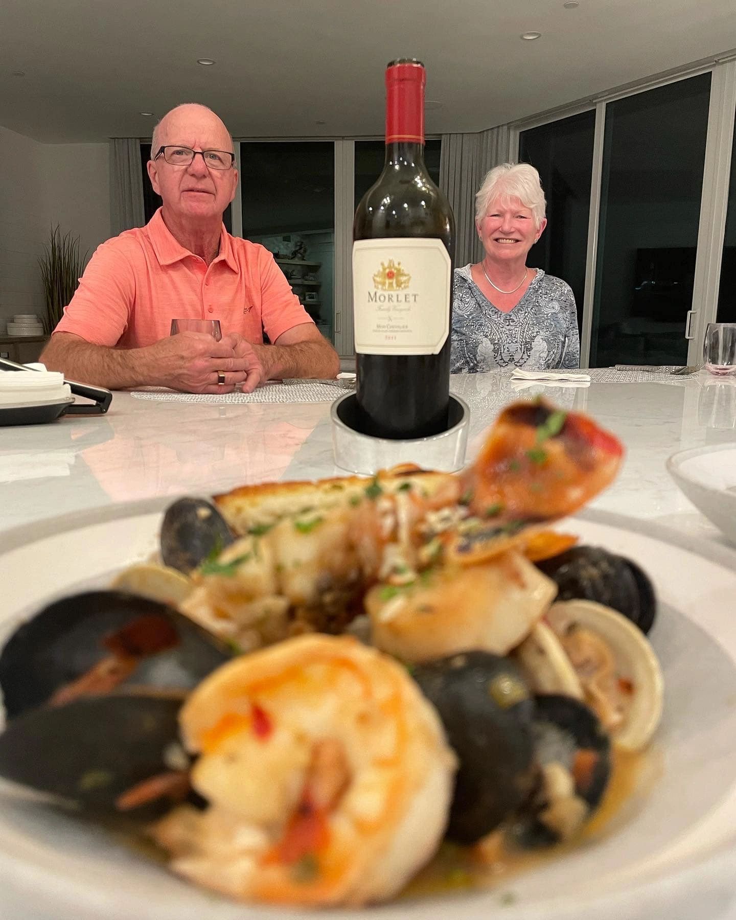 Couple dining with seafood and wine