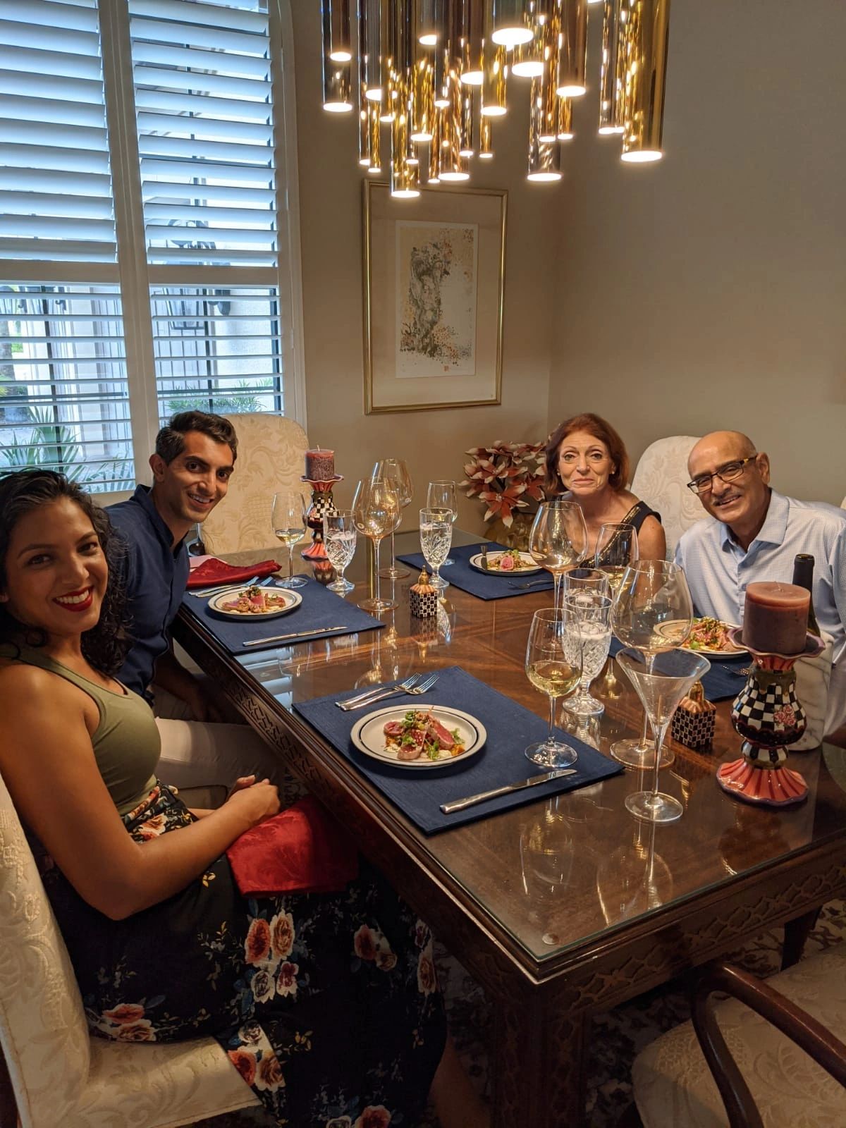 Family dinner gathering with elegant table setting.