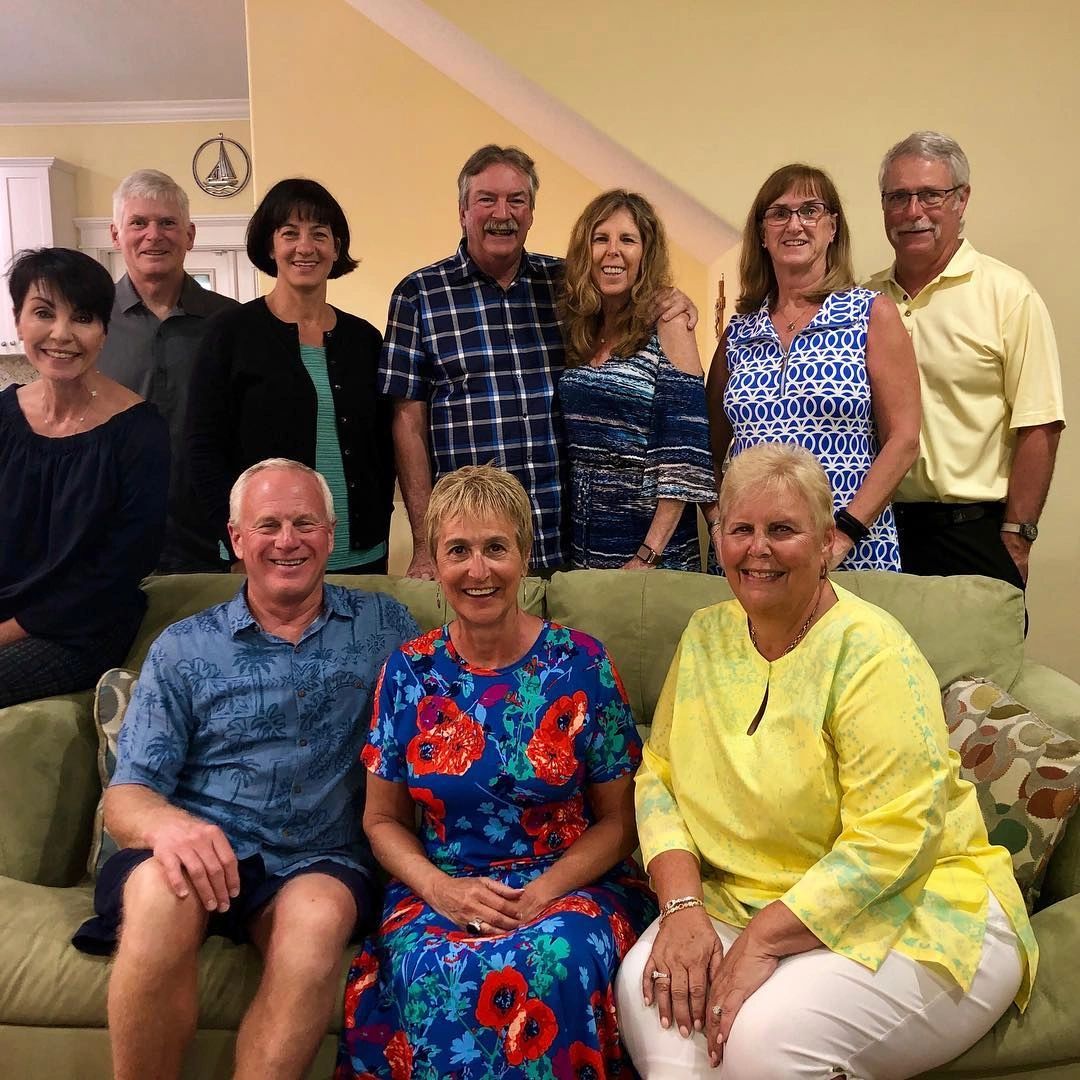 Group of people posing indoors