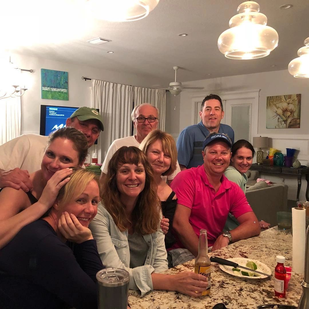 Friends gathered around a kitchen island
