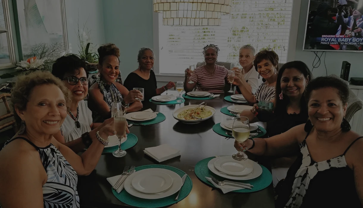 Women smiling at a dining table